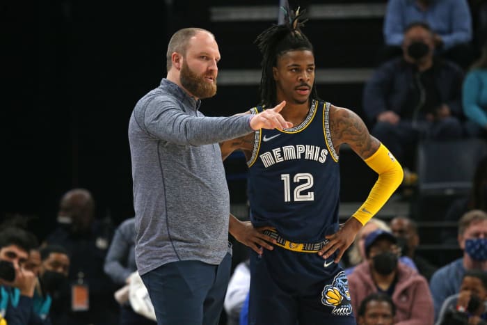 Memphis Grizzles head coach Taylor Jenkins (left) talks with guard Ja Morant (12) during the first half against the Utah Jazz at FedExForum.