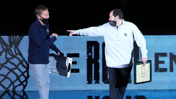 Mark Few and Scott Drew dressed in athleisure wear at the national title game