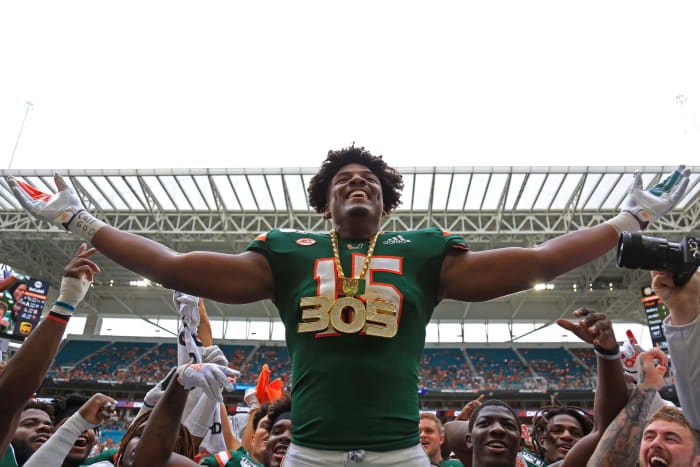Sep 21, 2019; Miami Gardens, FL, USA; Miami Hurricanes defensive lineman Gregory Rousseau (15) celebrates by wearing the turnover chain after recovering a fumble in the first quarter of a football game against the Central Michigan Chippewas at Hard Rock Stadium. Mandatory Credit: Sam Navarro-USA TODAY Sports