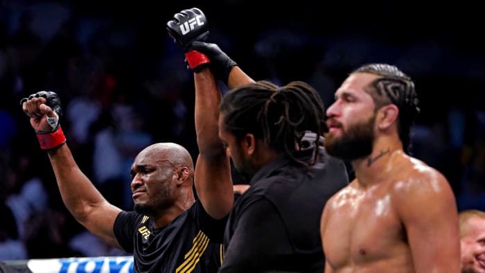 Kamaru Usman (Red Gloves) took action after defeating Jorge Masvidal (Blue Gloves) at UFC 261 at the VyStar Veterans Memorial Arena.