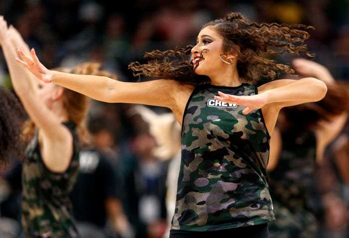 A dancer for the Milwaukee Bucks' 414 Crew performs during a game