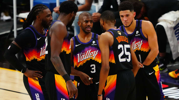 Jul 6, 2021; Phoenix, Arizona, USA; Phoenix Suns guard Chris Paul (3) with forward Jae Crowder (99) center Deandre Ayton (22) forward Mikal Bridges (25) and guard Devin Booker (1) against the Milwaukee Bucks during the first half in game one of the 2021NBA Finals at Phoenix Suns Arena.