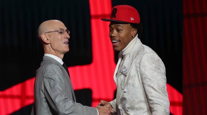Scottie Barnes (Florida State) poses with NBA commissioner Adam Silver after being selected as the number four overall pick by the Toronto Raptors in the first round of the 2021 NBA Draft