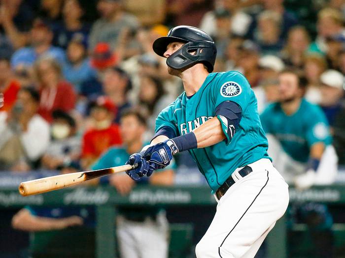July 9, 2021; Seattle, Washington, USA; Seattle Mariners designated hitter Mitch Haniger (17) watches his Grand Slam home run against the Los Angeles Angels during the eighth inning at T-Mobile Park.