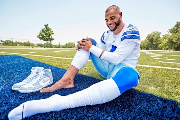 Dak Prescott poses for a photo, showing the scar on his right ankle