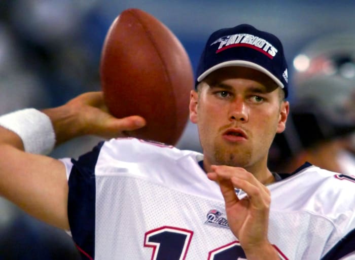 Tom Brady warms up during a preseason game in his rookie year in 2000
