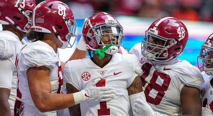 Alabama's Jameson Williams reacts after he scored a touchdown vs Miami