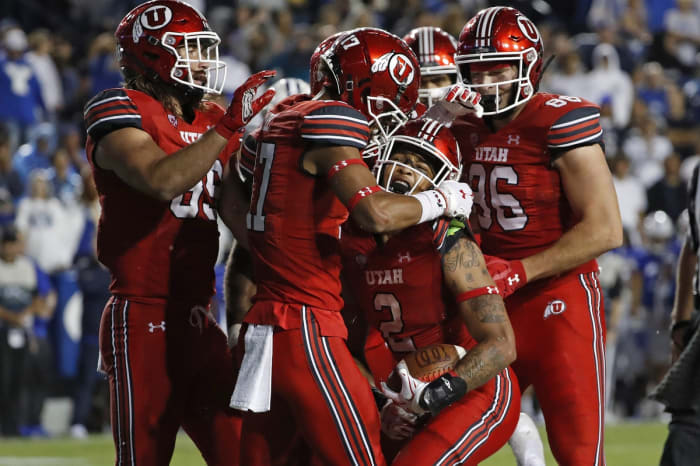 September 11, 2021;  Provo, Utah, United States;  Utah Utes running back Micah Bernard (2) celebrates his touchdown in the fourth quarter against the Brigham Young Cougars at LaVell Edwards Stadium.  Mandatory Credit: Jeffrey Swinger-USA TODAY Sports