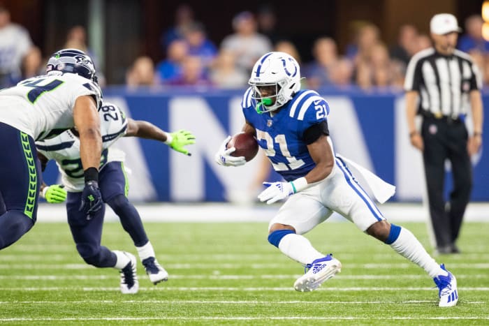 Sep 12, 2021; Indianapolis, Indiana, USA; Indianapolis Colts running back Nyheim Hines (21) runs the ball in the second half against the Seattle Seahawks at Lucas Oil Stadium.