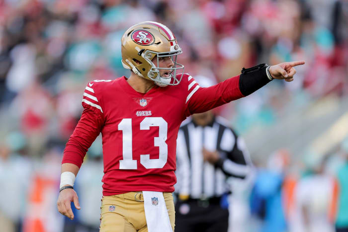 49ers quarterback Brock Purdy celebrates after throwing a touchdown pass in Week 13 against the Dolphins.