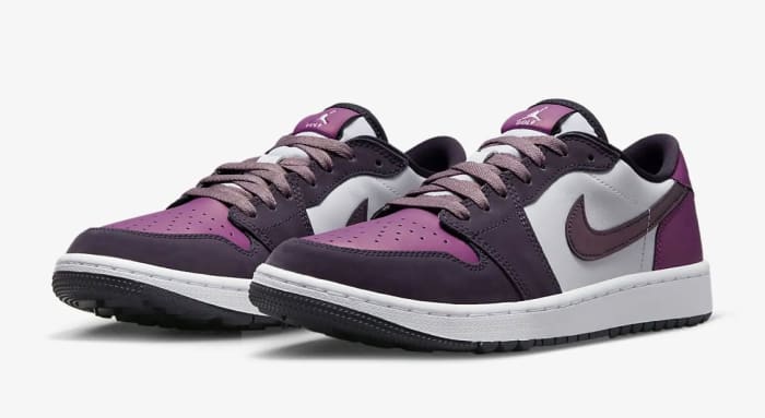 View of purple and white Jordan shoes.