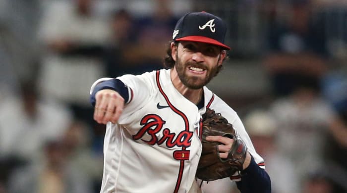 Shortstop Dansby Swanson throws a ball