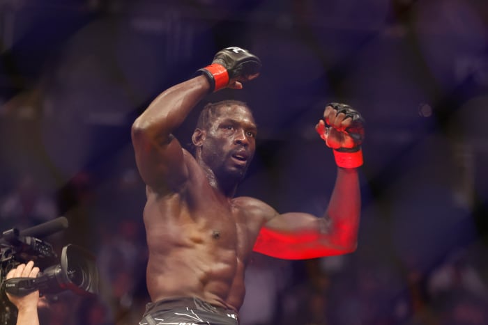 Jared Cannonier (red gloves) reacts after the fight against Derek Brunson (Blue Gloves) during UFC 271 at Toyota Center.