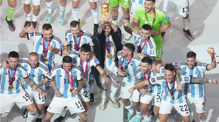 Lionel Messi lifting the World Cup trophy.