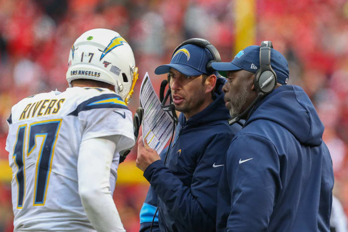 Philip Rivers taking coaching from Shane Steichen and Anthony Lynn during a game in 2019