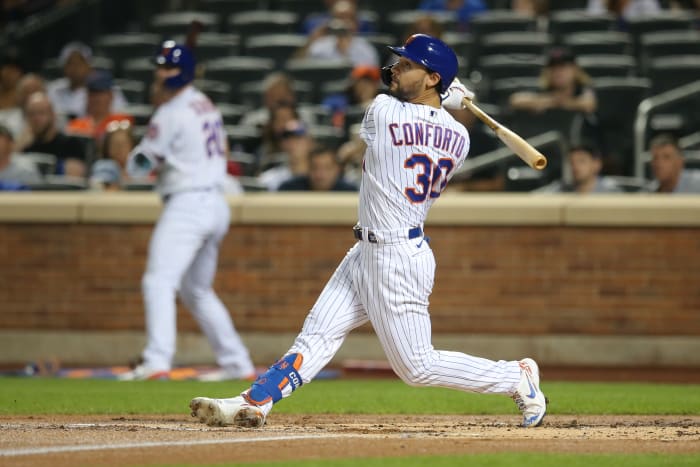 New York Mets right fielder Michael Conforto follows through on an RBI single against the St. Louis Cardinals. (2021)