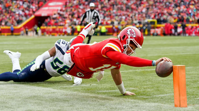 Patrick Mahomes dives for the end zone and just touches the ball against the tip of the pylon for a TD.