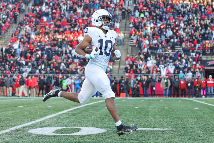 Penn State Nittany Lions running back Nicholas Singleton (10) returns a kickoff for a touchdown during the first half against the Rutgers Scarlet Knights at SHI Stadium.