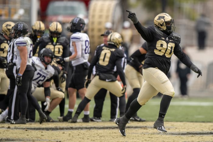 Nov 19, 2022; West Lafayette, Indiana, USA; Purdue Boilermakers defensive tackle Lawrence Johnson (90) celebrates a turnover during the second half against the Northwestern Wildcats at Ross-Ade Stadium. Mandatory Credit: Marc Lebryk-USA TODAY Sports