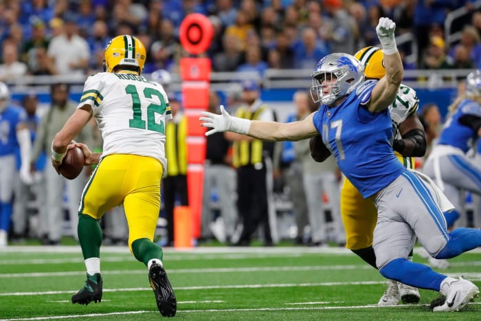 Green Bay Packers quarterback Aaron Rodgers and Detroit Lions lineman Aidan Hutchinson