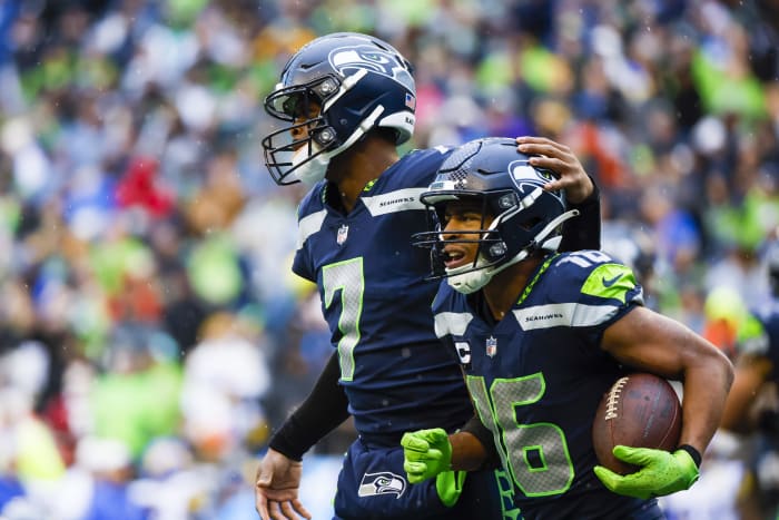 Jan 8, 2023; Seattle, Washington, USA; Seattle Seahawks quarterback Geno Smith (7) embraces wide receiver Tyler Lockett (16) following a touchdown pass against the Los Angeles Rams during the third quarter at Lumen Field.