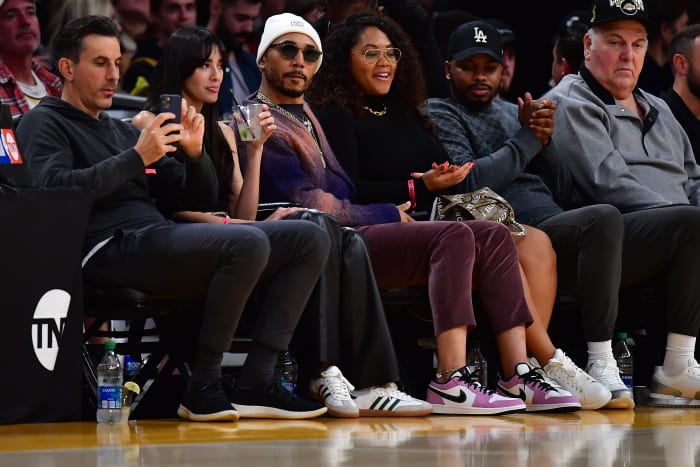 Mookie Betts sits courtside during a Lakers game.