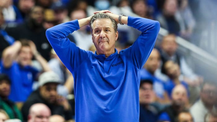 John Calipari from Kentucky holds his hands on his head