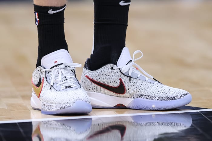 View of white and black Nike LeBron shoes.