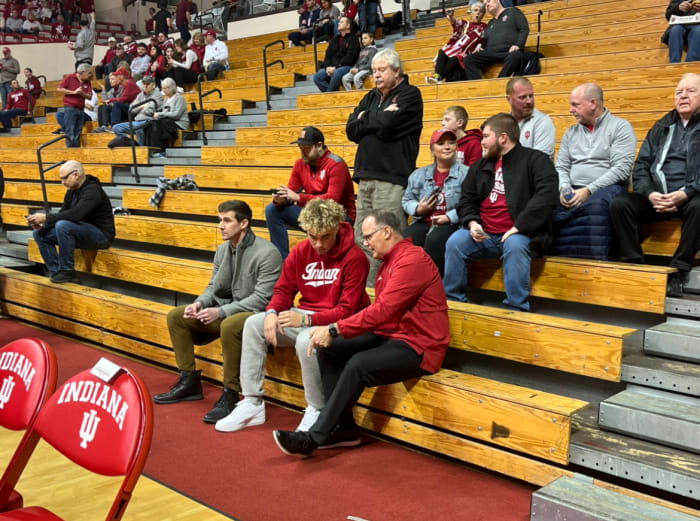 Indiana Football Offensive Coordinator Walt Bell (left), quarterback recruit Tayven Jackson (center) and head coach Tom Allen (right) speak prior to the Indiana vs. Wisconsin basketball game Saturday, January 14 at Simon Skjodt Assembly Hall in Bloomington, Indiana . 
