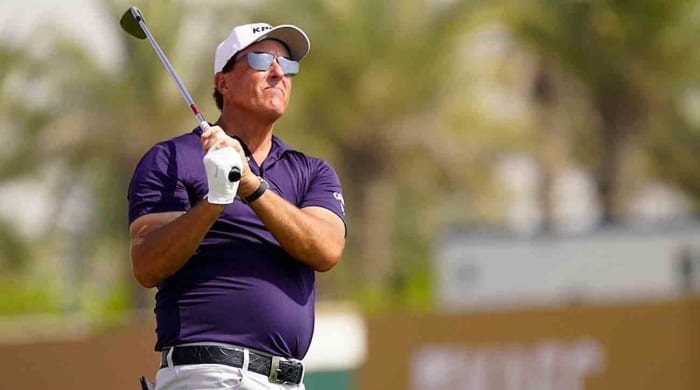 Phil Mickelson watches a shot at the 2022 Saudi International.