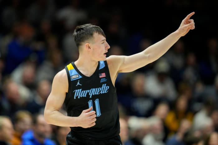 Marquette guard Tyler Kolek (11) reacts after scoring in the first half of an NCAA college basketball game against Xavier Sunday, January 15, 2023 in Cincinnati.