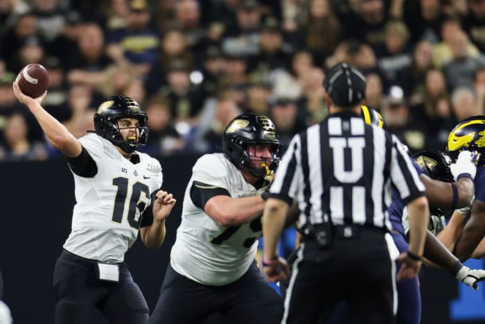 Indianapolis, Indiana, USA; Purdue Boilermakers quarterback Aidan O'Connell (16) passes during the first half of the Big Ten Championship against the Michigan Wolverines at Lucas Oil Stadium.