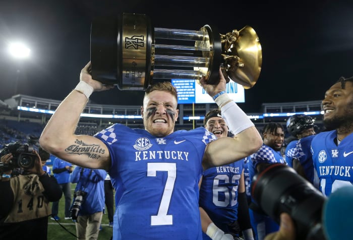Kentucky's Will Levis grimaces while hoisting the 2022 Governor's Cup trophy after the Wildcats defeated Louisville. Nov. 26, 2022 Louisville Vs Kentucky 2022 Football Syndication The Courier Journal