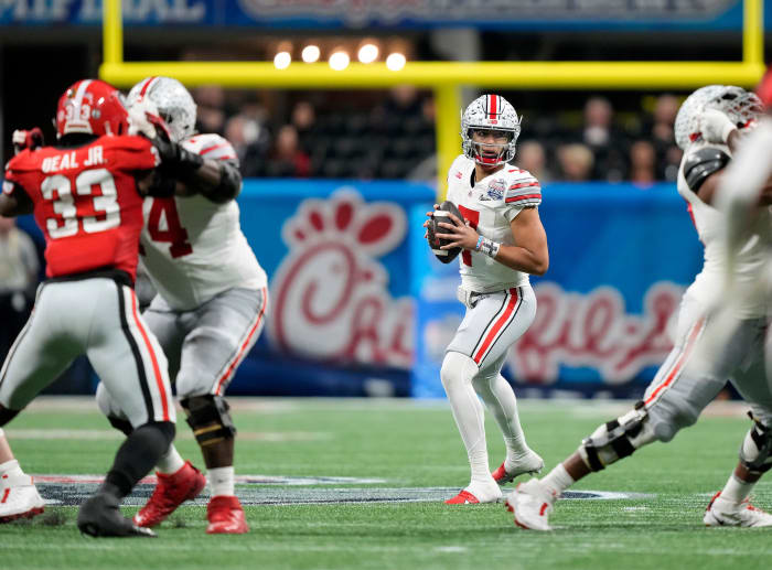 Atlanta, Georgia, USA; Ohio State Buckeyes quarterback C.J. Stroud (7) drops back to throw the ball against Georgia Bulldogs in the third quarter during the Peach Bowl in the College Football Playoff semifinal at Mercedes-Benz Stadium