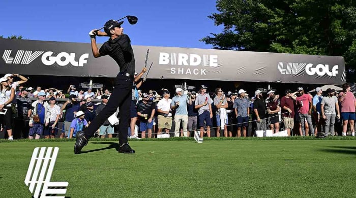 Joaquin Niemann tees off at a 2022 LIV Golf event.