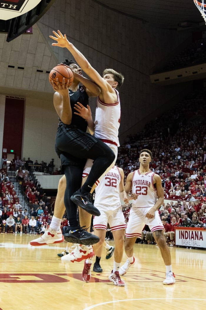 Michigan State Spartans guard AJ Hoggard (11) shoots the ball while Indiana Hoosiers forward Miller Kopp (12) defends in the second half at Simon Skjodt Assembly Hall.