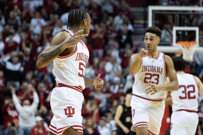 Indiana Hoosiers guard Tamar Bates (53) celebrates a basket hit against the Michigan State Spartans with assistance from center Trayce Jackson-Davis (23).