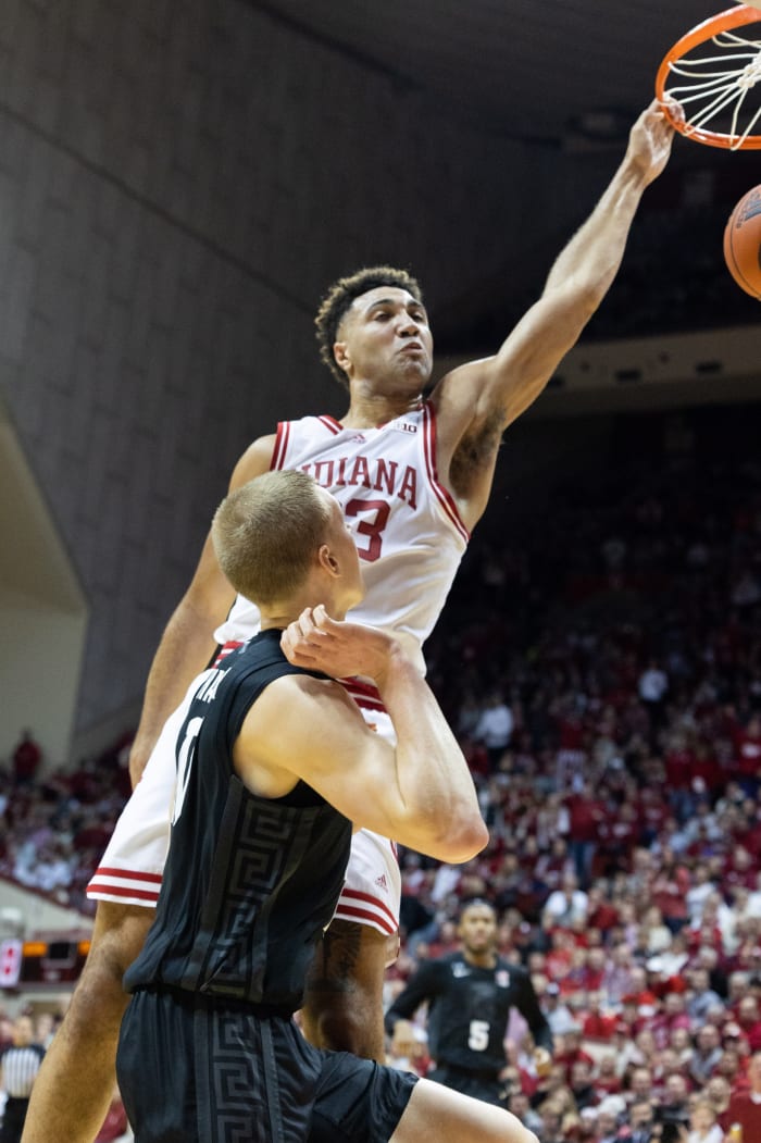 Indiana Hoosiers forward Trayce Jackson-Davis (23) duns the ball while Michigan State Spartans forward Joey Hauser (10) defends.