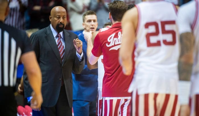 Indiana head coach Mike Woodson punches players before Sunday's game against Michigan State.