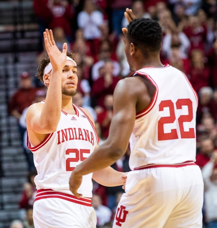Indiana's Race Thompson (25) checks in the first game since his injury for Indiana's Jordan Geronimo (22) during the first half of the Indiana vs. Michigan State game.