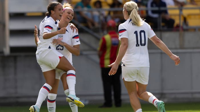 United States women's soccer forward Mallory Swanson celebrates her goal with Trinity Rodman and Lindsey Horan.