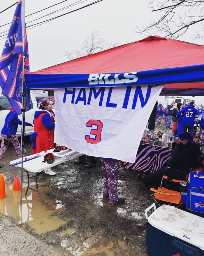 A tent in the Bills parking lot hangs a Damar Hamlin flag