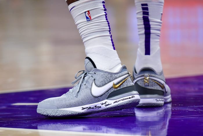 View of LeBron James' grey and white Nike shoes.