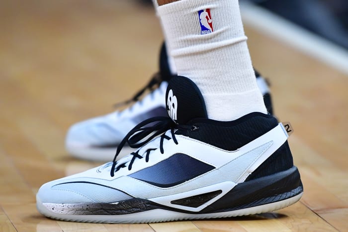 View of Kawhi Leonard's black and white New Balance shoes.