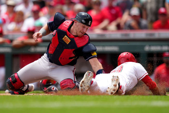 Jun 25, 2023; Cincinnati, Ohio, USA; Atlanta Braves catcher Sean Murphy (12) tags out Cincinnati Reds center fielder TJ Friedl (29) at home plate in the first inning of a baseball game at Great American Ball Park. Mandatory Credit: Kareem Elgazzar-USA TODAY Sports
