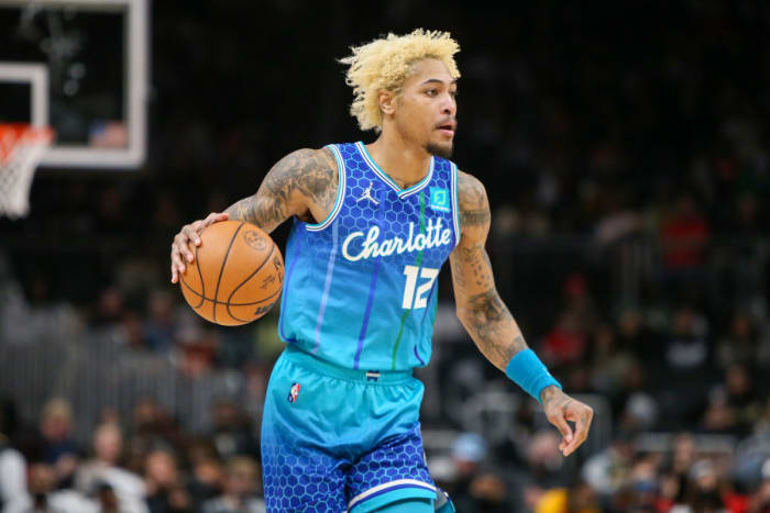 Charlotte Hornets guard Kelly Oubre Jr. (12) dribbles the ball against the Atlanta Hawks in the second quarter at State Farm Arena.
