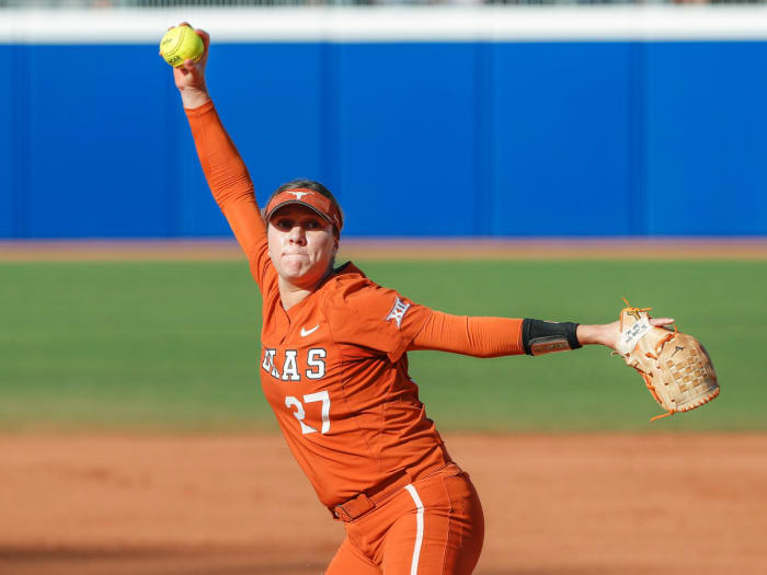 Texas pitcher Hailey Dolcini winds up for a pitch