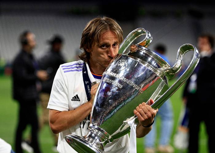 Luka Modric pictured kissing the Champions League trophy after Real Madrid beat Liverpool 1-0 in the 2021/22 final