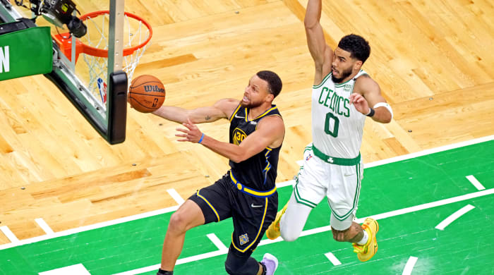 Stephen Curry drives by Jayson Tatum in Game 4 of the 2022 NBA Finals.