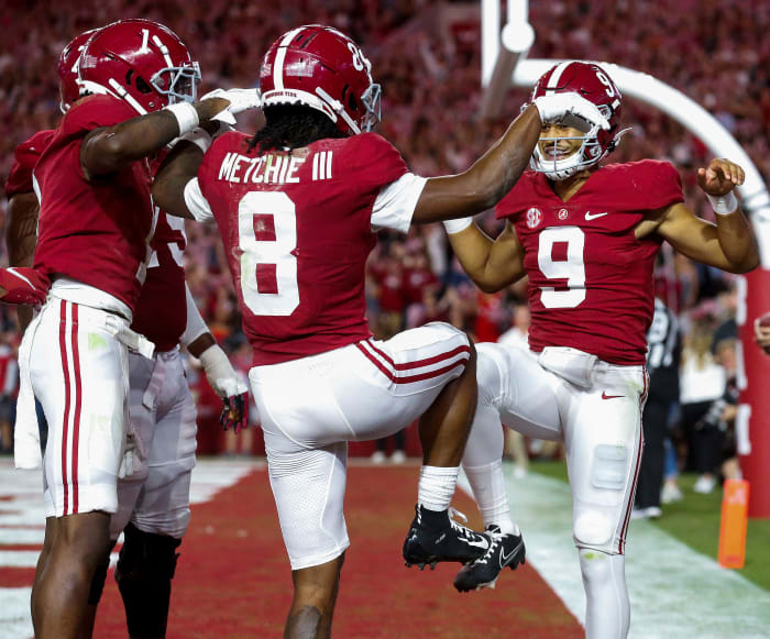 October 23, 2021;  Tuscaloosa, Alabama, USA;  Alabama Crimson Tide wide receiver Jameson Williams (1) and wide receiver John Metchie III (8) and quarterback Bryce Young (9) celebrate after a scrimmage against the Tennessee Volunteers during the first half at Bryant-Denny Stadium.  Mandatory Credit: Gary Cosby Jr.-USA TODAY Sports